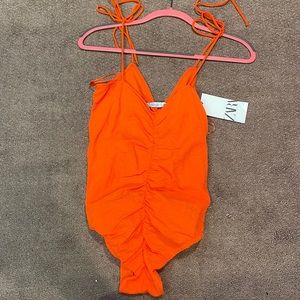 amazing orange color body suit